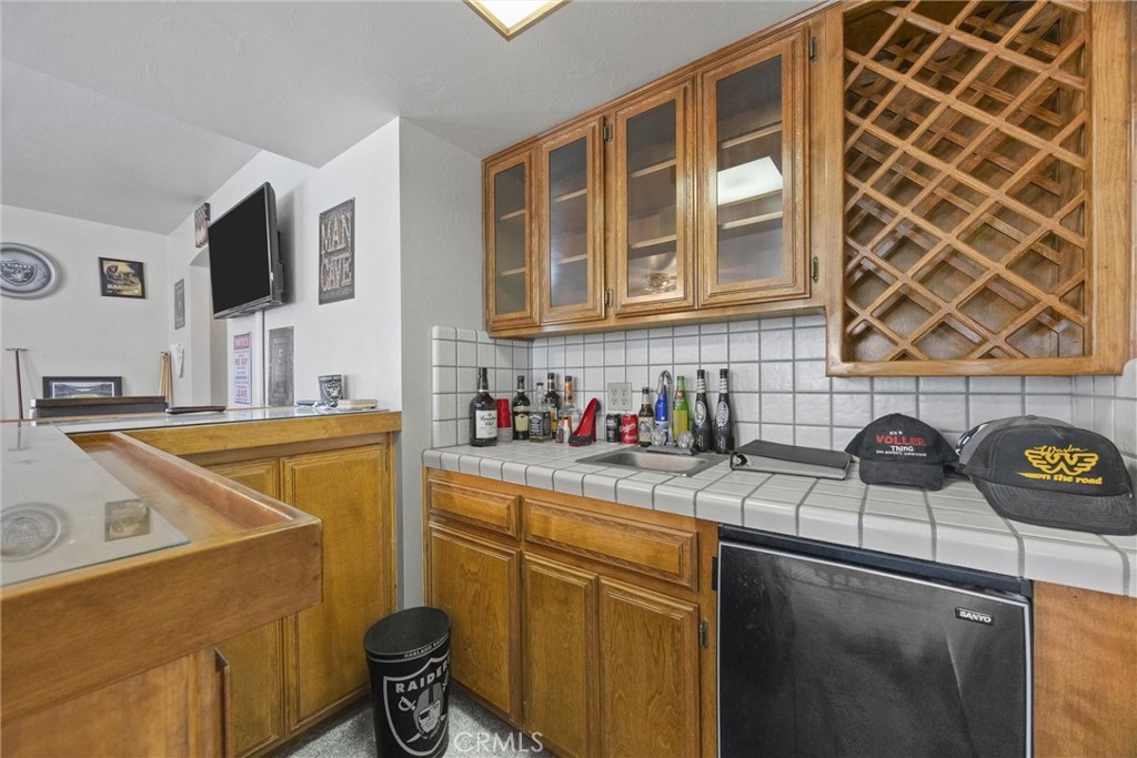 3512 McCray Road Mountain Mesa, CA 93240 - Photo 27 of 60 a kitchen with a sink and a stove top oven