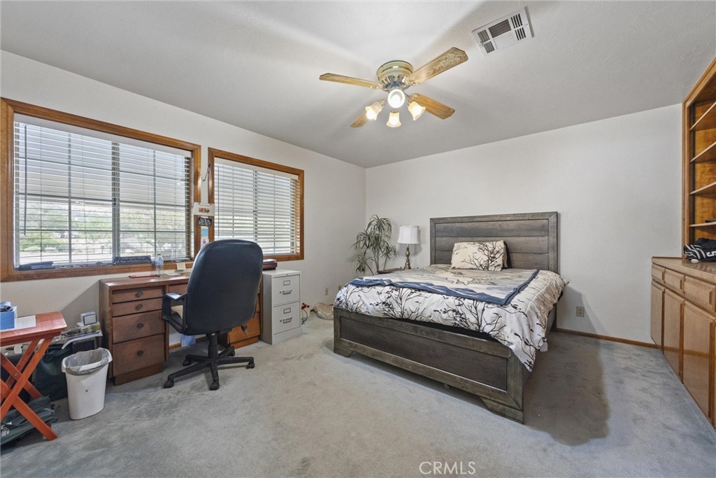3512 McCray Road Mountain Mesa, CA 93240 - Photo 35 of 60 a bedroom with a bed and a desk