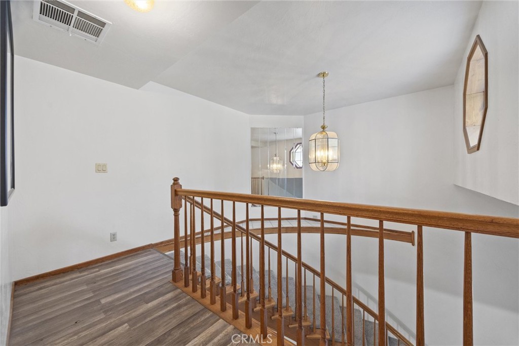 3512 McCray Road Mountain Mesa, CA 93240 - Photo 39 of 60 a view of a hallway with wooden floor and stairs