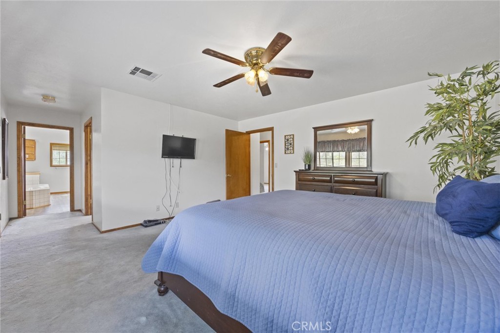 3512 McCray Road Mountain Mesa, CA 93240 - Photo 42 of 60 a bedroom with a bed and a potted plant