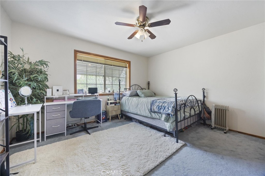 3512 McCray Road Mountain Mesa, CA 93240 - Photo 48 of 60 a bedroom with a bed gym equipment and a desk
