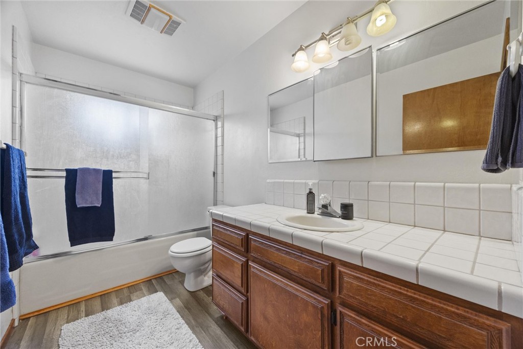 3512 McCray Road Mountain Mesa, CA 93240 - Photo 49 of 60 a bathroom with a sink a toilet and mirror