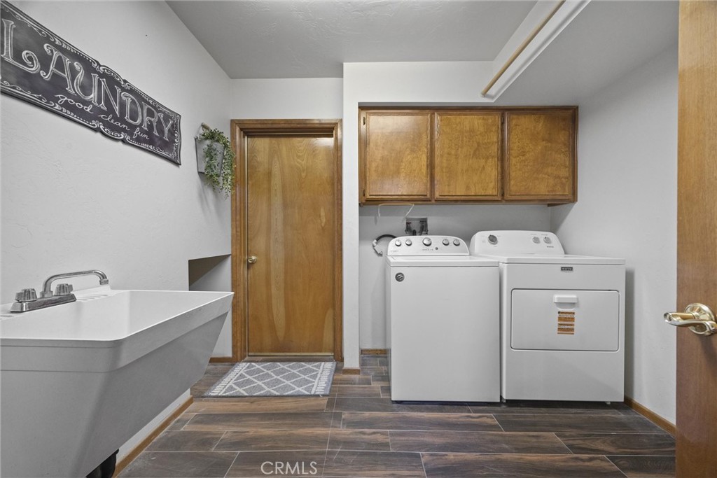 3512 McCray Road Mountain Mesa, CA 93240 - Photo 52 of 60 a utility room with cabinets washer and dryer