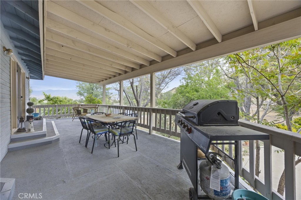 3512 McCray Road Mountain Mesa, CA 93240 - Photo 53 of 60 a view of a patio with a table chairs and a backyard