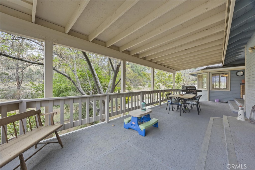 3512 McCray Road Mountain Mesa, CA 93240 - Photo 54 of 60 a view of a porch with furniture and a yard