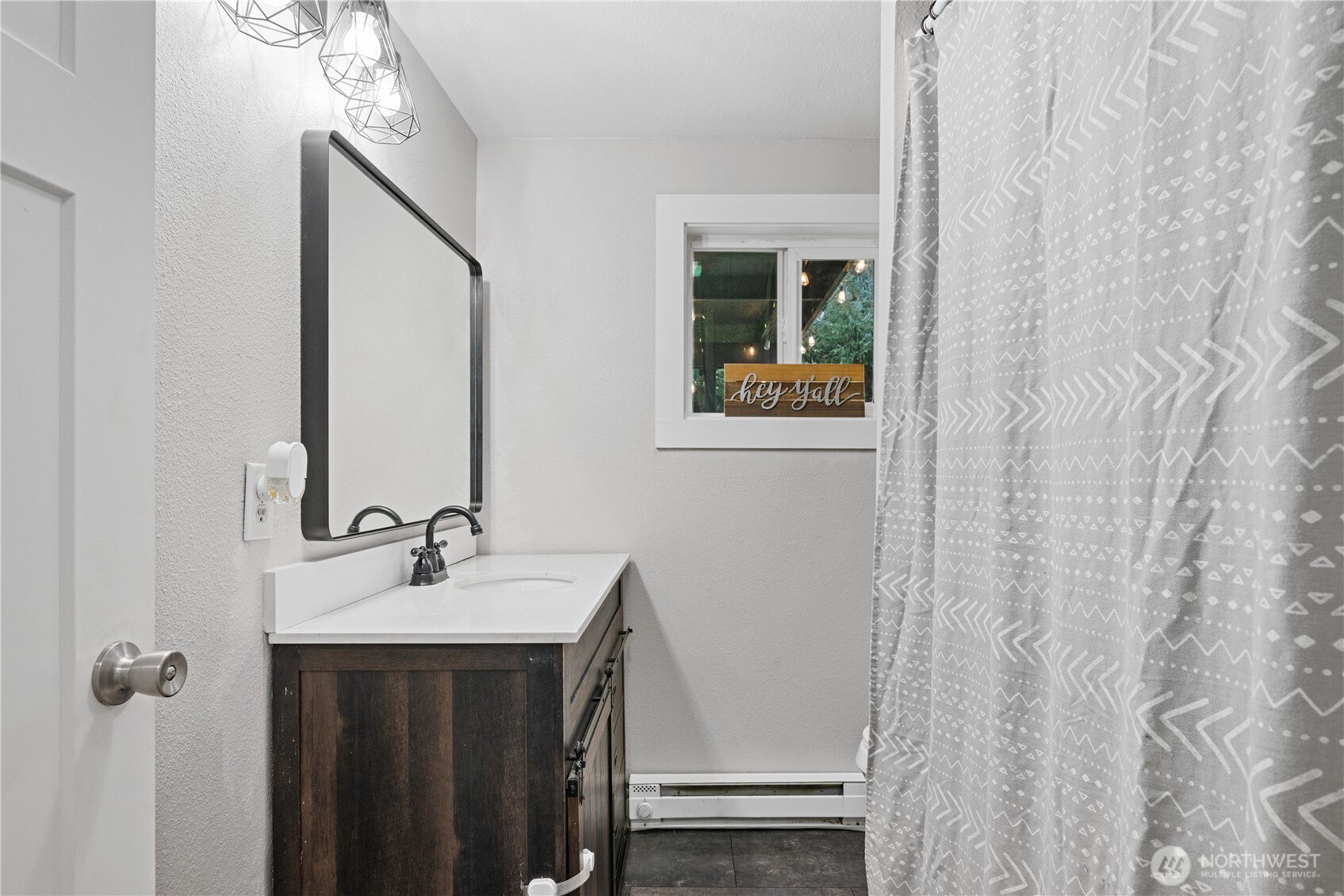 3317 Olive Way Longview, WA 98632 - Photo 14 of 29 a bathroom with a sink and a mirror
