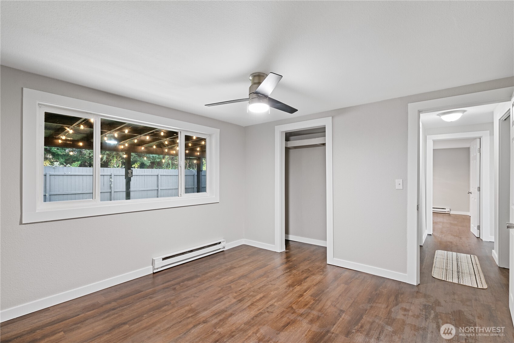3317 Olive Way Longview, WA 98632 - Photo 16 of 29 a view of an empty room with wooden floor and a window
