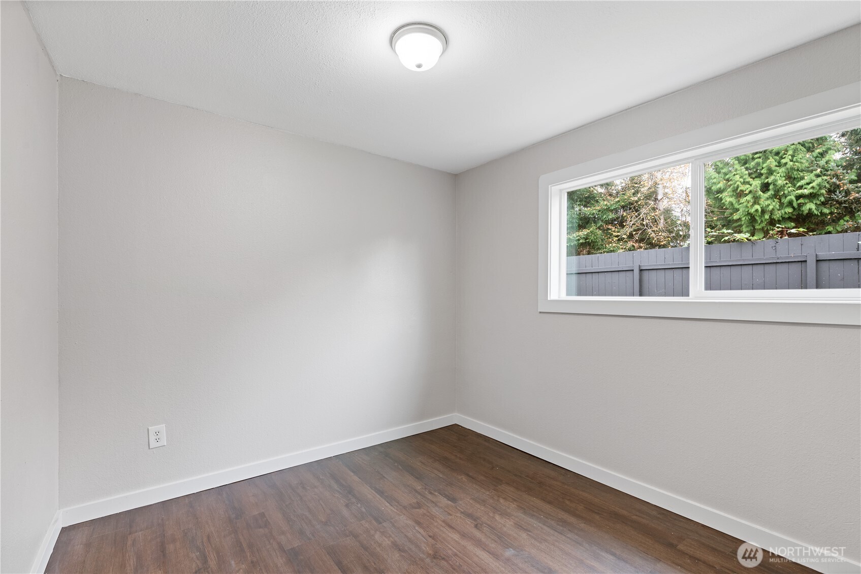 3317 Olive Way Longview, WA 98632 - Photo 20 of 29 an empty room with wooden floor and windows