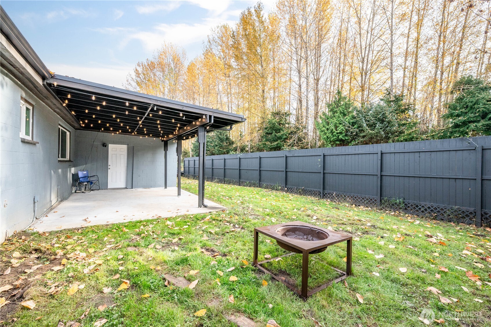3317 Olive Way Longview, WA 98632 - Photo 23 of 29 a backyard of a house with table and chairs