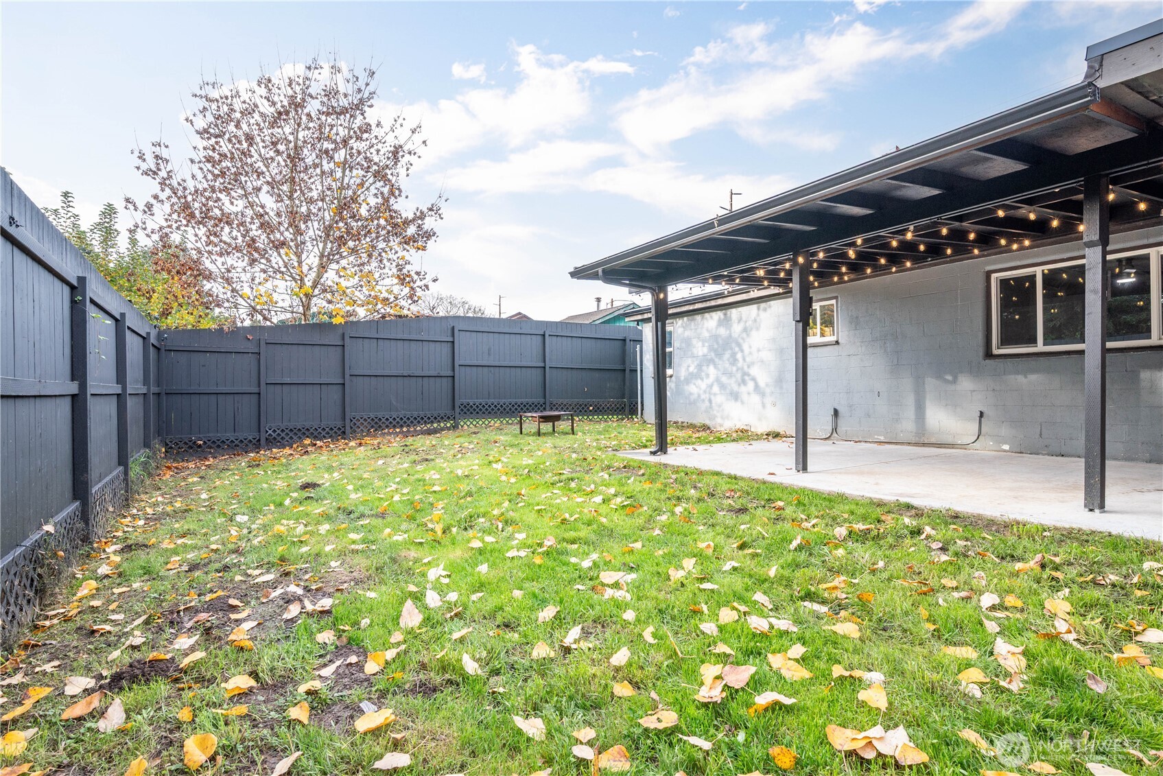 3317 Olive Way Longview, WA 98632 - Photo 25 of 29 a backyard of a house with a small yard and wooden fence