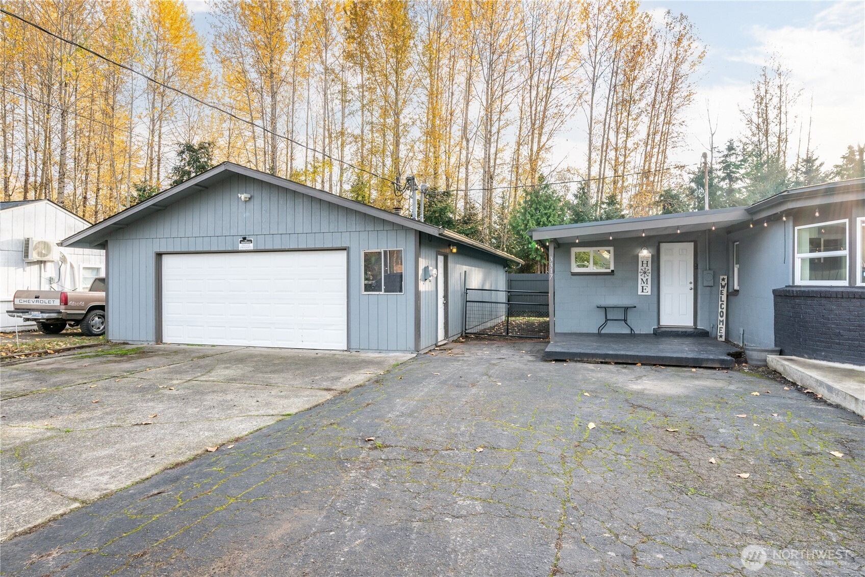 3317 Olive Way Longview, WA 98632 - Photo 27 of 29 a view of a house with a outdoor space and a tree