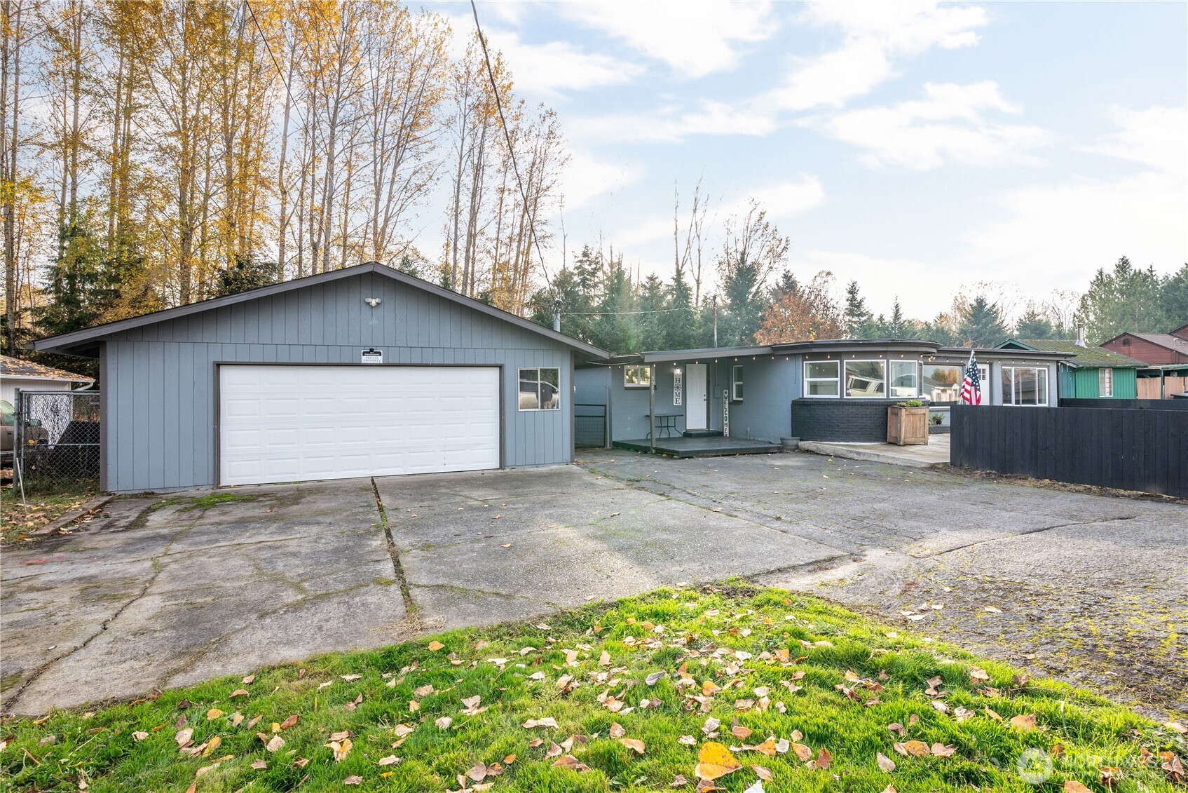 3317 Olive Way Longview, WA 98632 - Photo 3 of 29 a front view of a house with a yard and garage
