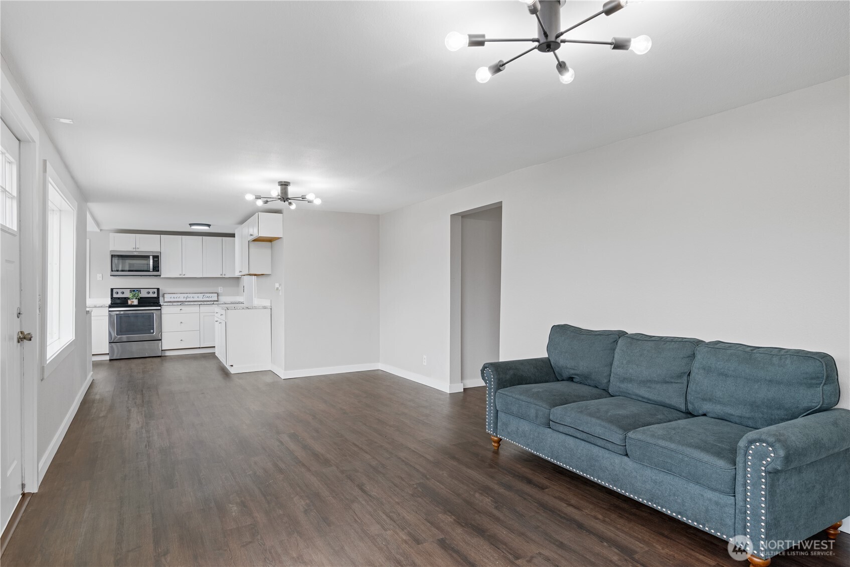 3317 Olive Way Longview, WA 98632 - Photo 6 of 29 a living room with furniture and kitchen view