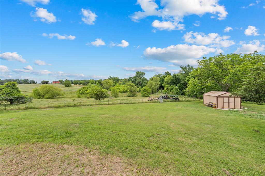608 West Spring Street West, TX 76691 - Photo 24 of 27 a view of a big yard with lots of green space