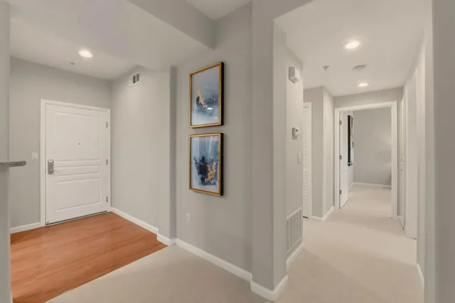 wooden floor with a bathroom