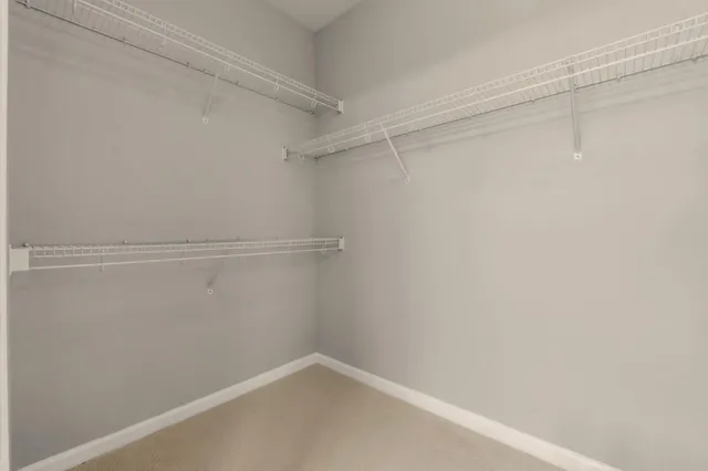 a view of a room with shelf on the wall