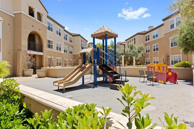 a view of a swimming pool with a lounge chair