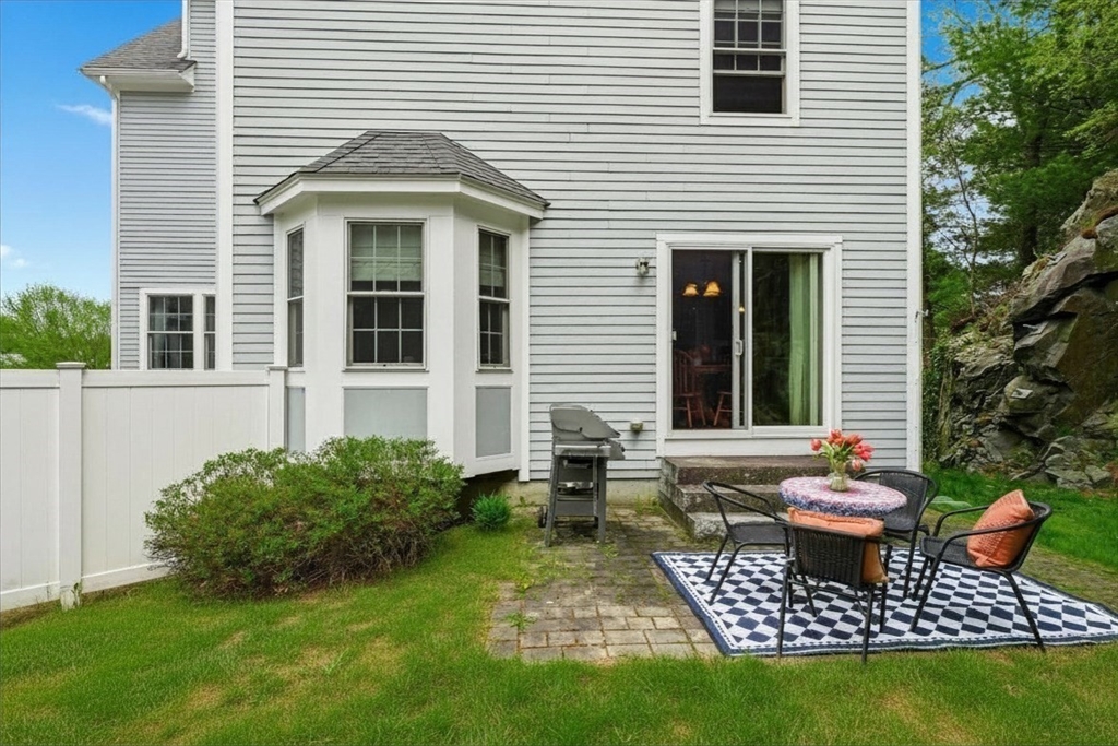 2 B Gates Lane, Unit B Wakefield, MA 01880 - Photo 26 of 42 a backyard of a house with outdoor seating
