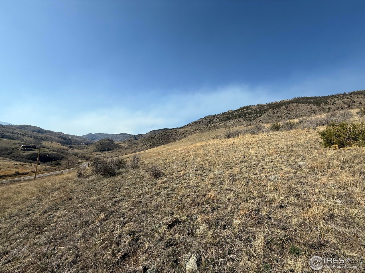 14750 Buckhorn Road Loveland, CO 80538 - Photo 31 of 39 a view of a large mountain with mountains in the background