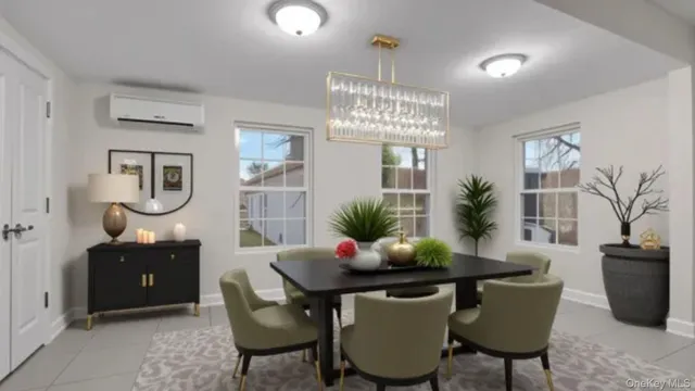 a view of a dining room with furniture and chandelier
