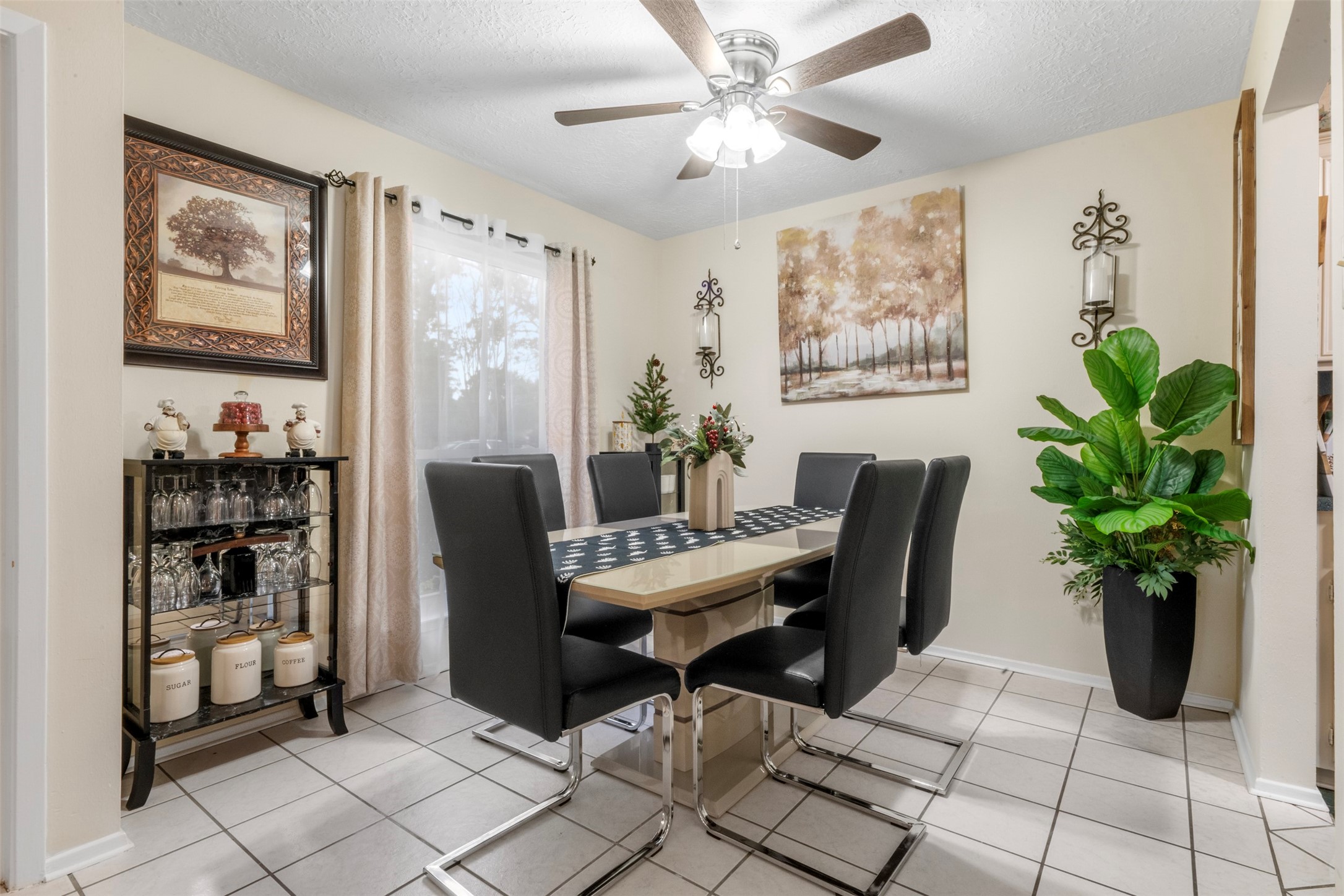 1114 Poppets Way Crosby, TX 77532 - Photo 14 of 48 A sunlit dining area featuring a large custom window that brings abundant sunlight.