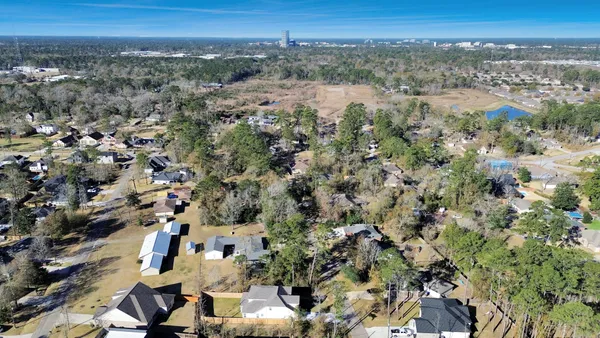 an aerial view of a city with lots of residential buildings