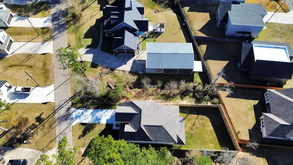 an aerial view of house with yard