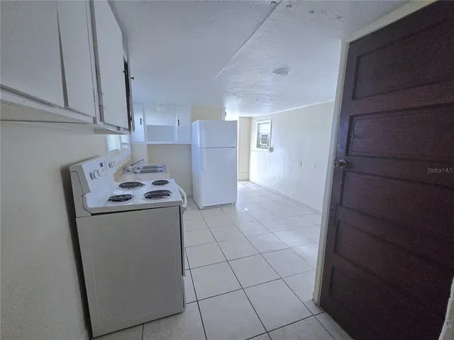 a utility room with closet a washer and dryer