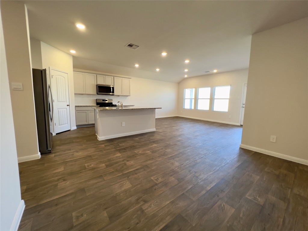 314 Addison Place Lockhart, TX 78644 - Photo 1 of 33 a kitchen with stainless steel appliances a refrigerator and a stove top oven