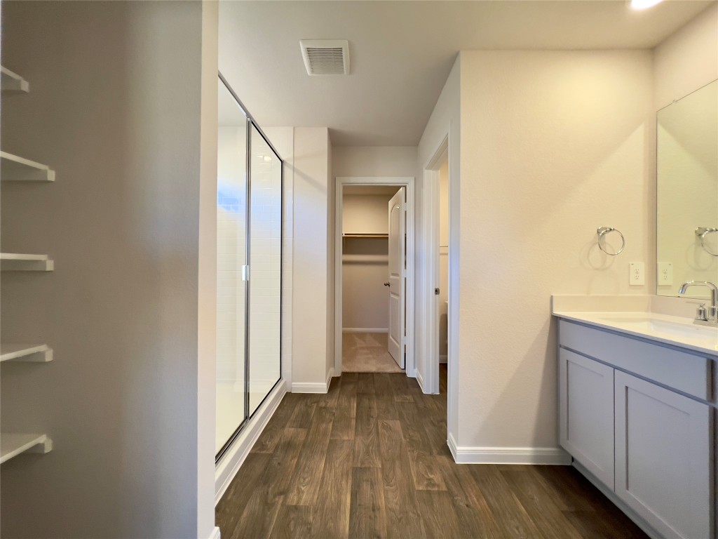 314 Addison Place Lockhart, TX 78644 - Photo 11 of 33 a view of a hallway with wooden floor