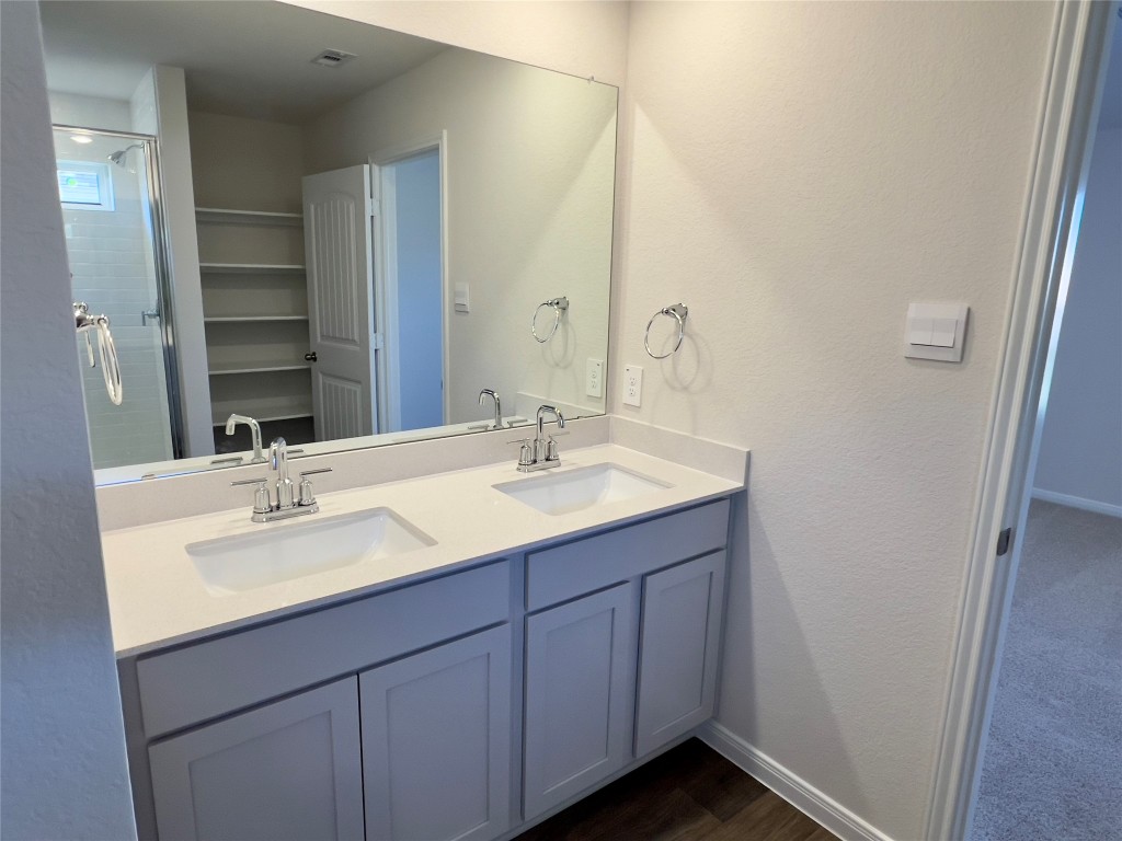 314 Addison Place Lockhart, TX 78644 - Photo 13 of 33 a bathroom with a sink and a mirror