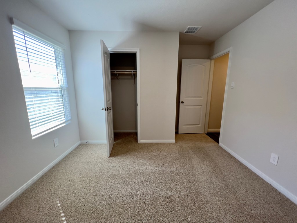314 Addison Place Lockhart, TX 78644 - Photo 21 of 33 an empty room with windows