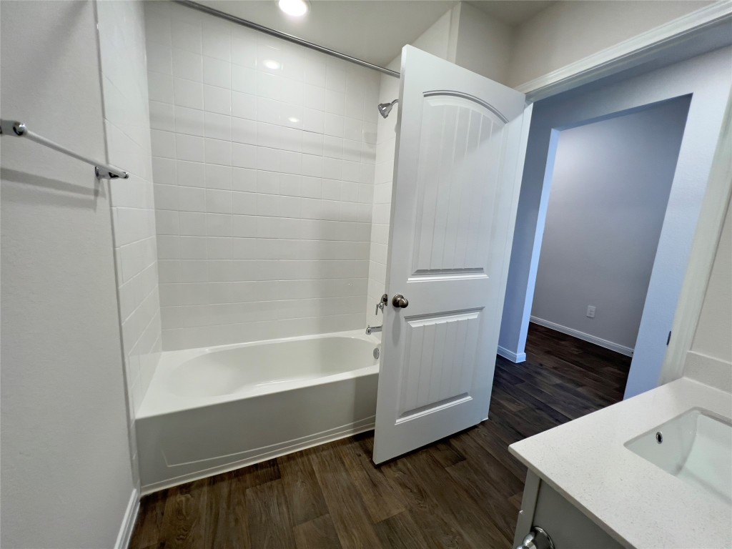 314 Addison Place Lockhart, TX 78644 - Photo 25 of 33 a bathroom with a bathtub a sink and a toilet