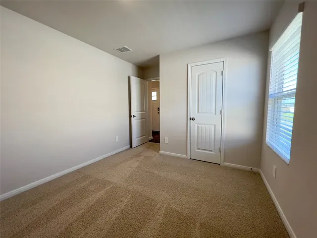 a backyard of a house with yard barbeque oven and a table