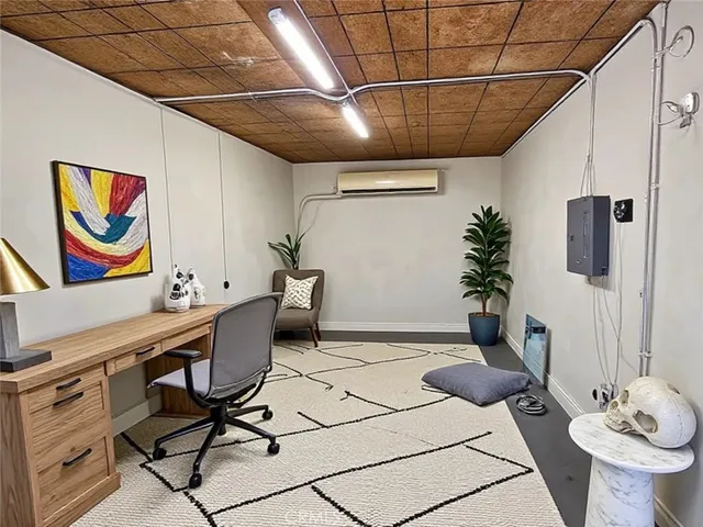 a work room with furniture and wooden floor
