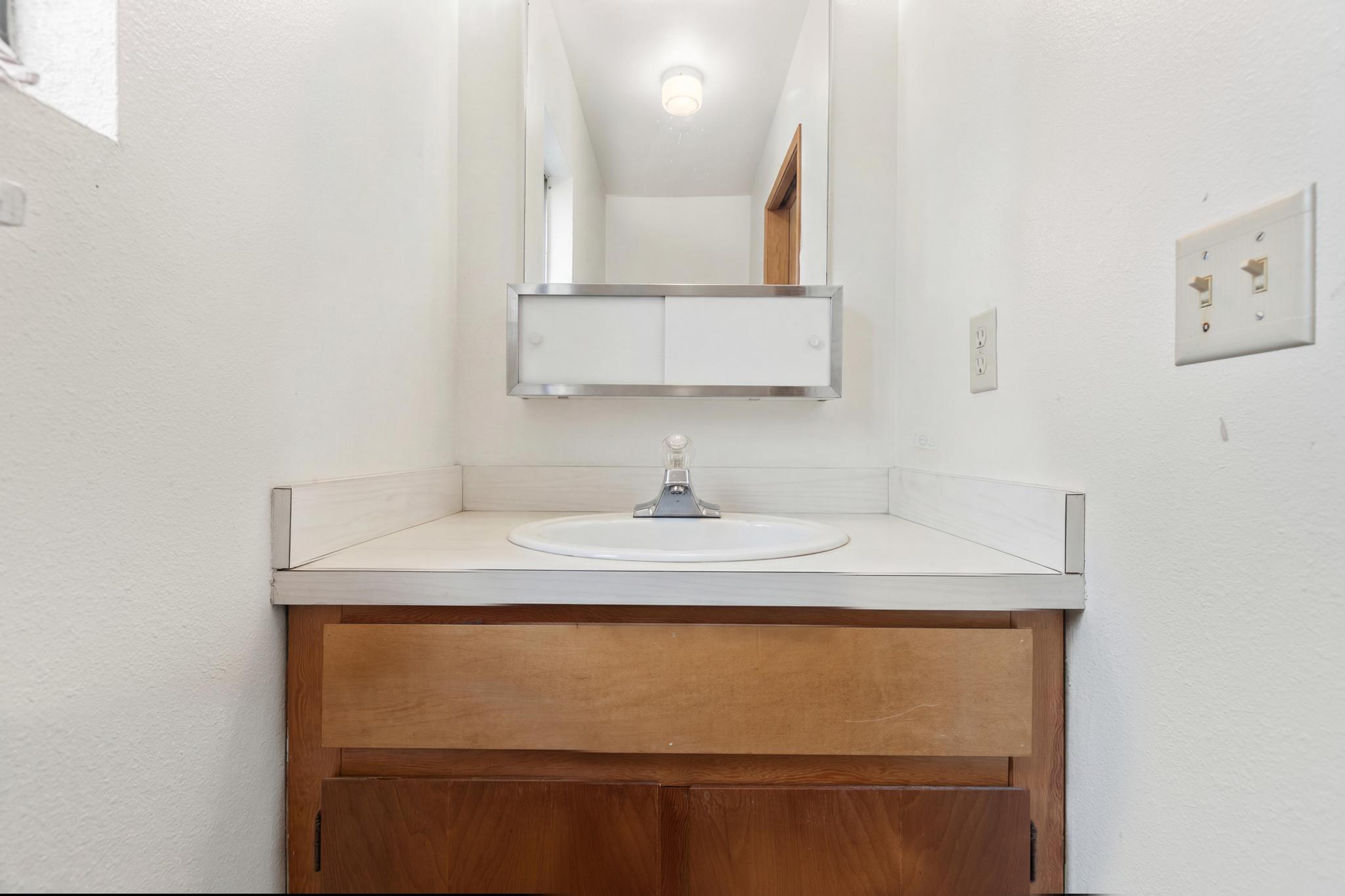 54-382 Union Mill Road Kapaau, HI 96755 - Photo 12 of 28 a bathroom with a sink and a mirror