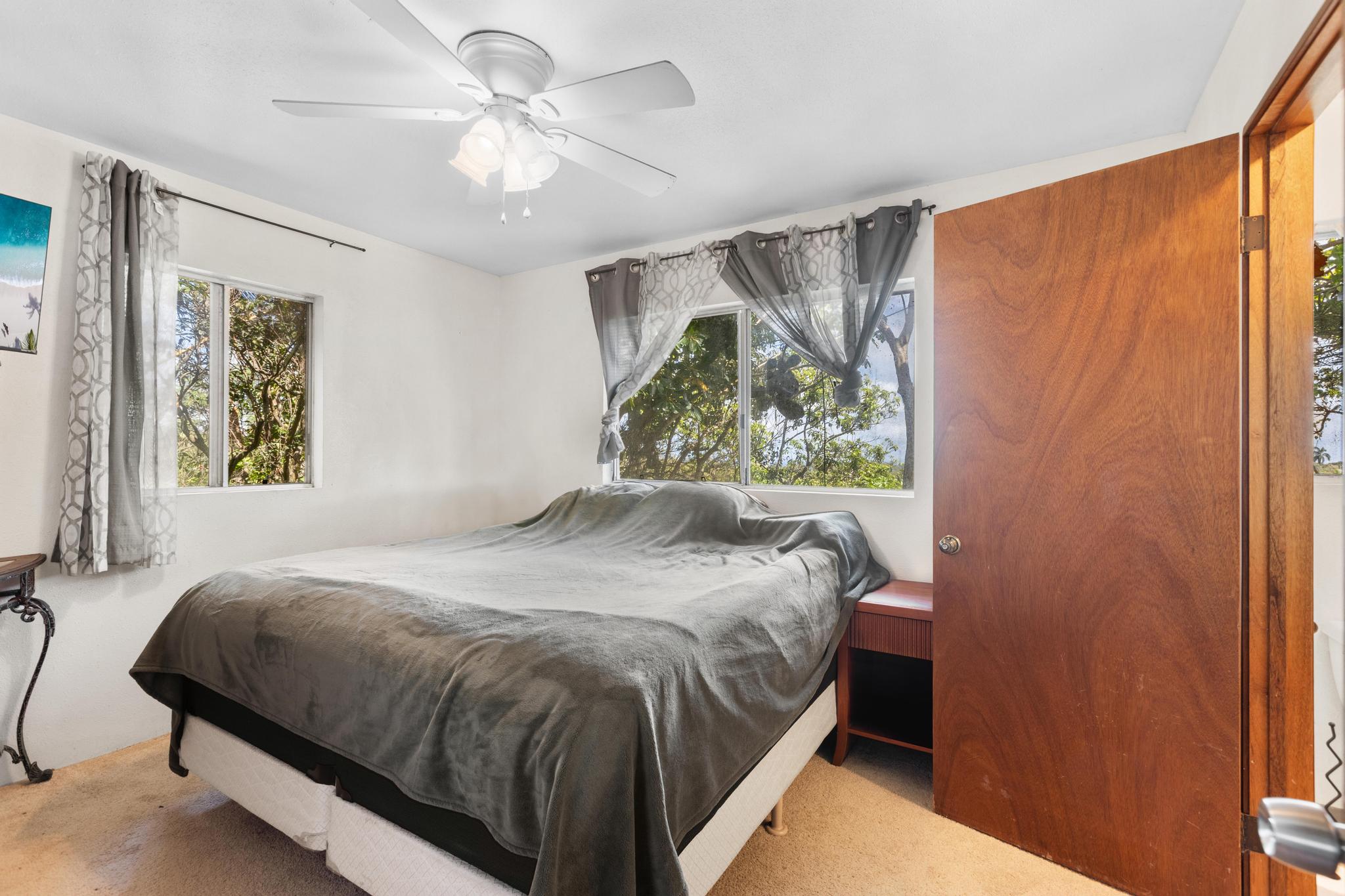 54-382 Union Mill Road Kapaau, HI 96755 - Photo 18 of 28 a bedroom with a bed and a window