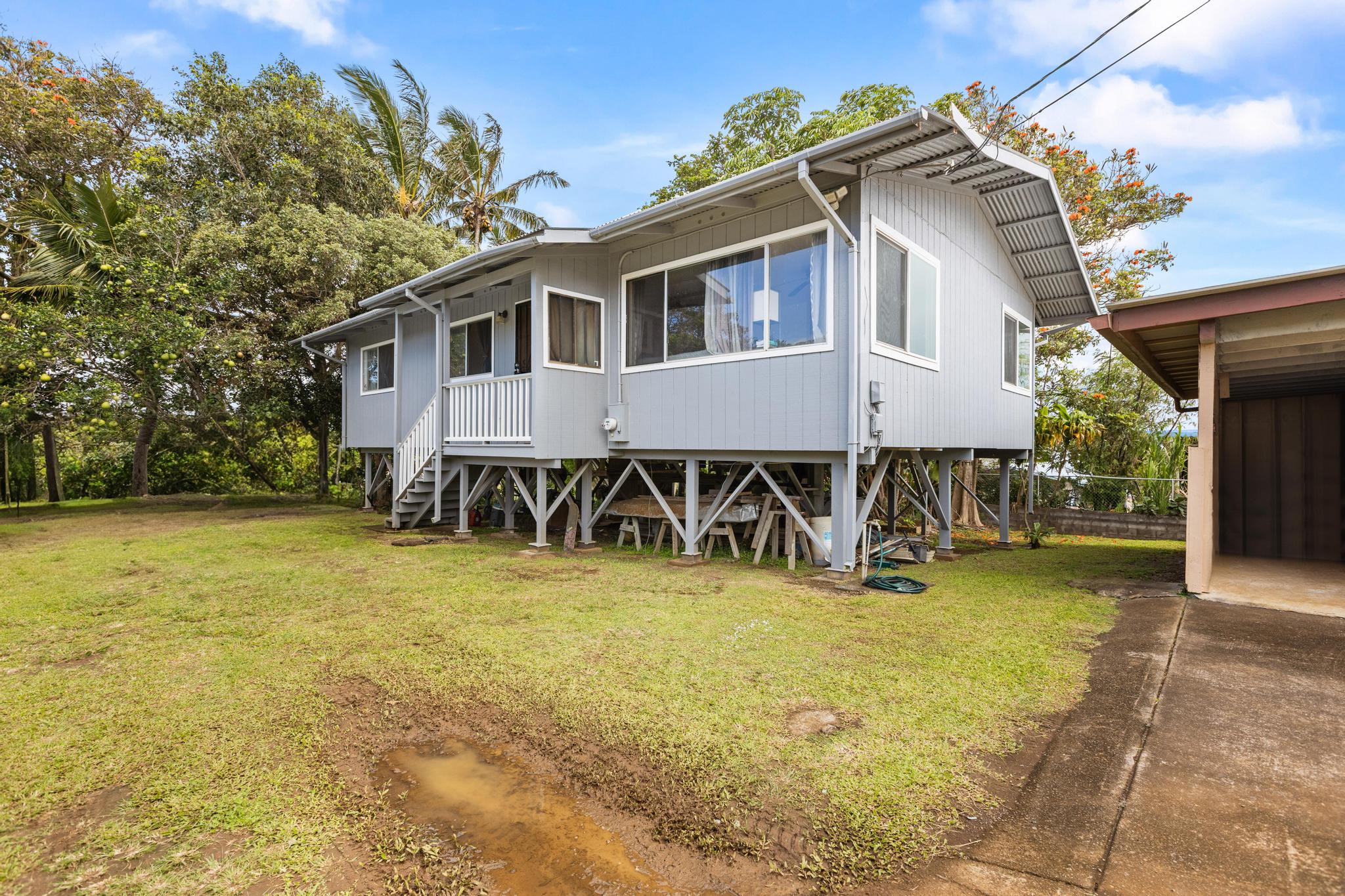 54-382 Union Mill Road Kapaau, HI 96755 - Photo 2 of 28 a front view of a house with a yard