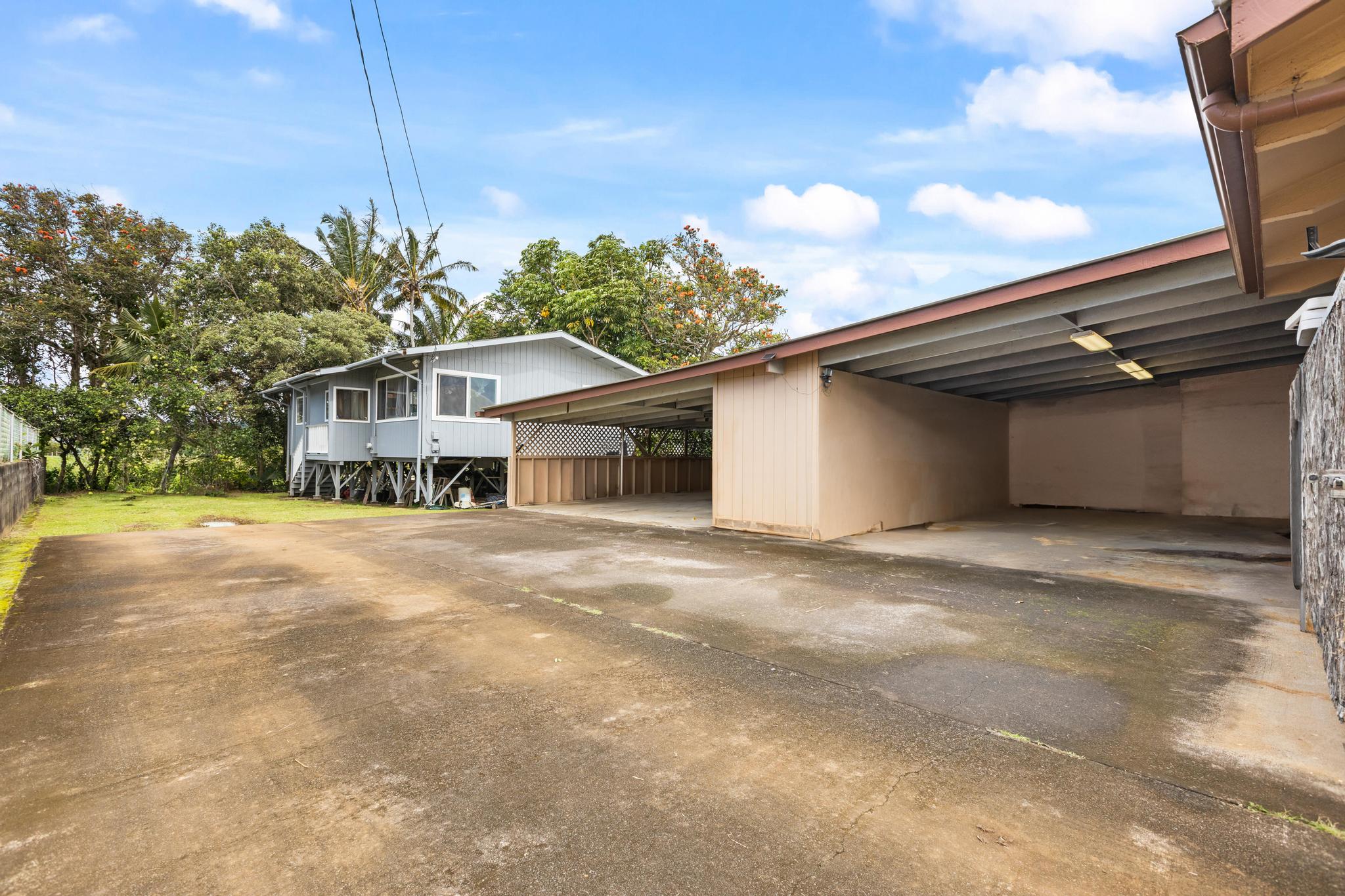 54-382 Union Mill Road Kapaau, HI 96755 - Photo 3 of 28 a front view of a house with a yard and garage