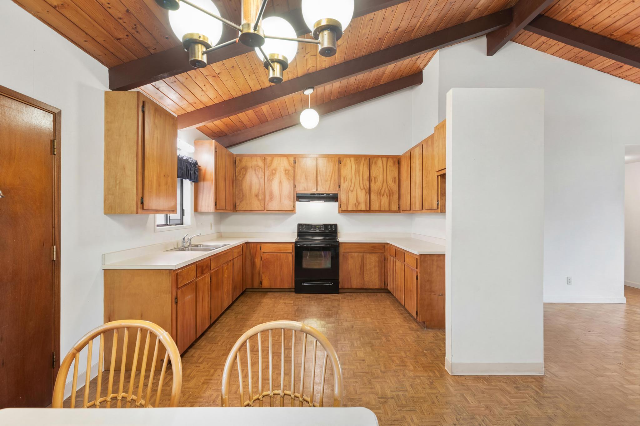 54-382 Union Mill Road Kapaau, HI 96755 - Photo 6 of 28 a view of living room kitchen with furniture and wooden floor