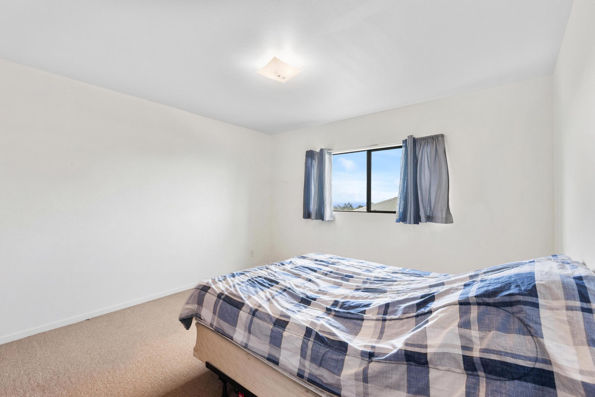 54-382 Union Mill Road Kapaau, HI 96755 - Photo 9 of 28 a bedroom with a bed and a window