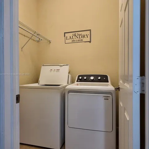 a utility room with dryer and washer