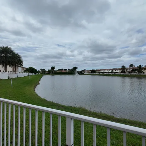 a view of a lake from a balcony