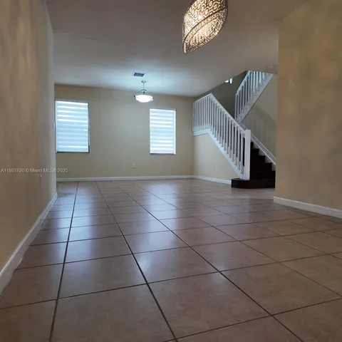 a view of entryway and hall with a window