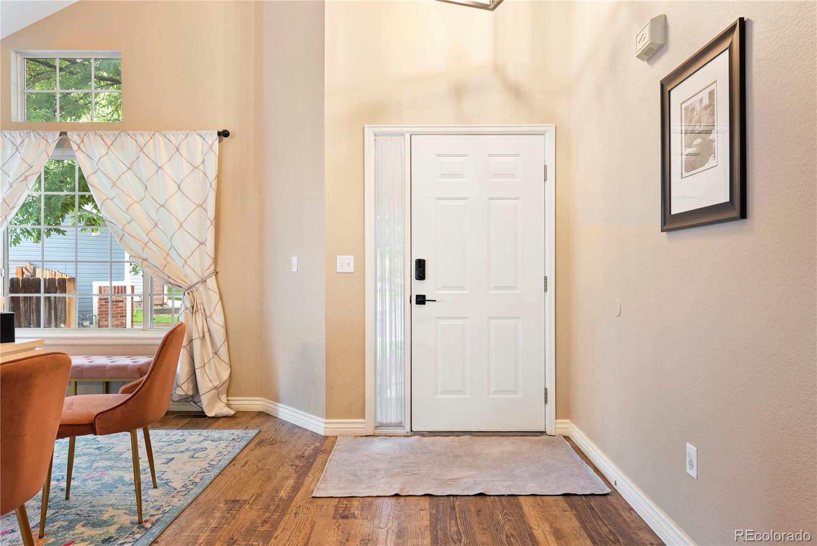 9756 Quay Loop Broomfield, CO 80021 - Photo 3 of 32 a view of a livingroom with furniture and staircase