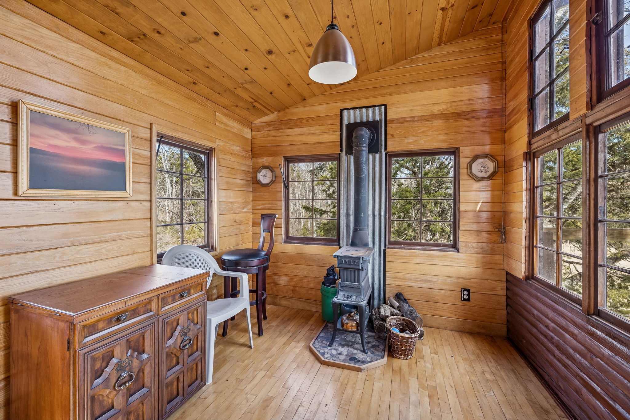 935 Comer Road Lascassas, TN 37085 - Photo 26 of 77 a dining room with wooden floor and large windows