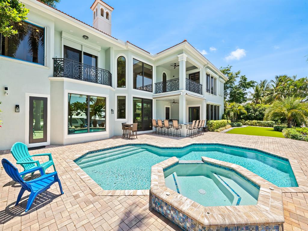 2817 Northeast 26th Avenue Lighthouse Point, FL 33064 - Photo 5 of 51 a swimming pool with outdoor seating yard and barbeque oven