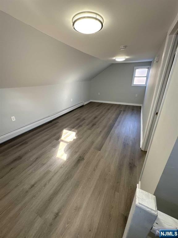 108 Madison Street Paterson, NJ 07501 - Photo 2 of 15 wooden floor in an empty room with a window