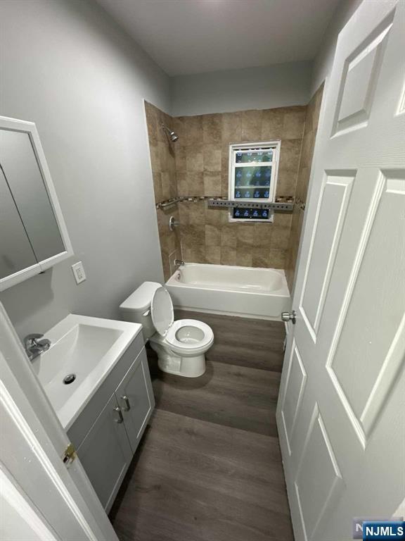 108 Madison Street Paterson, NJ 07501 - Photo 4 of 15 a bathroom with a bathtub sink and toilet