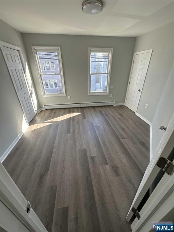 108 Madison Street Paterson, NJ 07501 - Photo 7 of 15 wooden floor in an empty room with a window